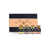 Kitchen Basics Geschenk-Box aus schwarzem Karton mit vier Korkengläsern davor.