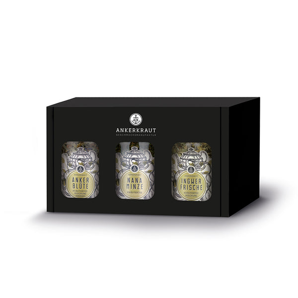 Kräutertee Geschenkset von Ankerkraut, bestehend aus drei Korkengläsern in einer schwarzen Geschenkbox.