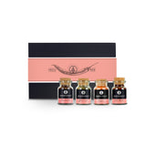 Chili Geschenkset von Ankerkraut mit vier Korkengläsern vor einer Geschenkbox mit Chilischote auf der Banderole.