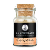 Pilzbrühe von Ankerkraut im Korkenglas auf weißem Hintergrund.