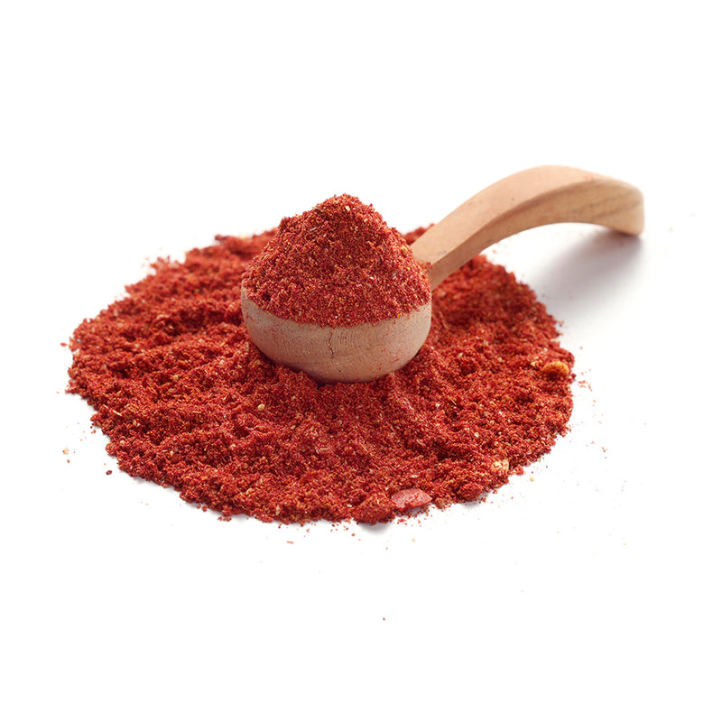 Pink Curry Gewürz von Ankerkraut als Häufchen auf einem Gewürzlöffel.