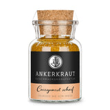 Scharfes Currywurst Gewürz von Ankerkraut im Korkenglas auf weißem Hintergrund.